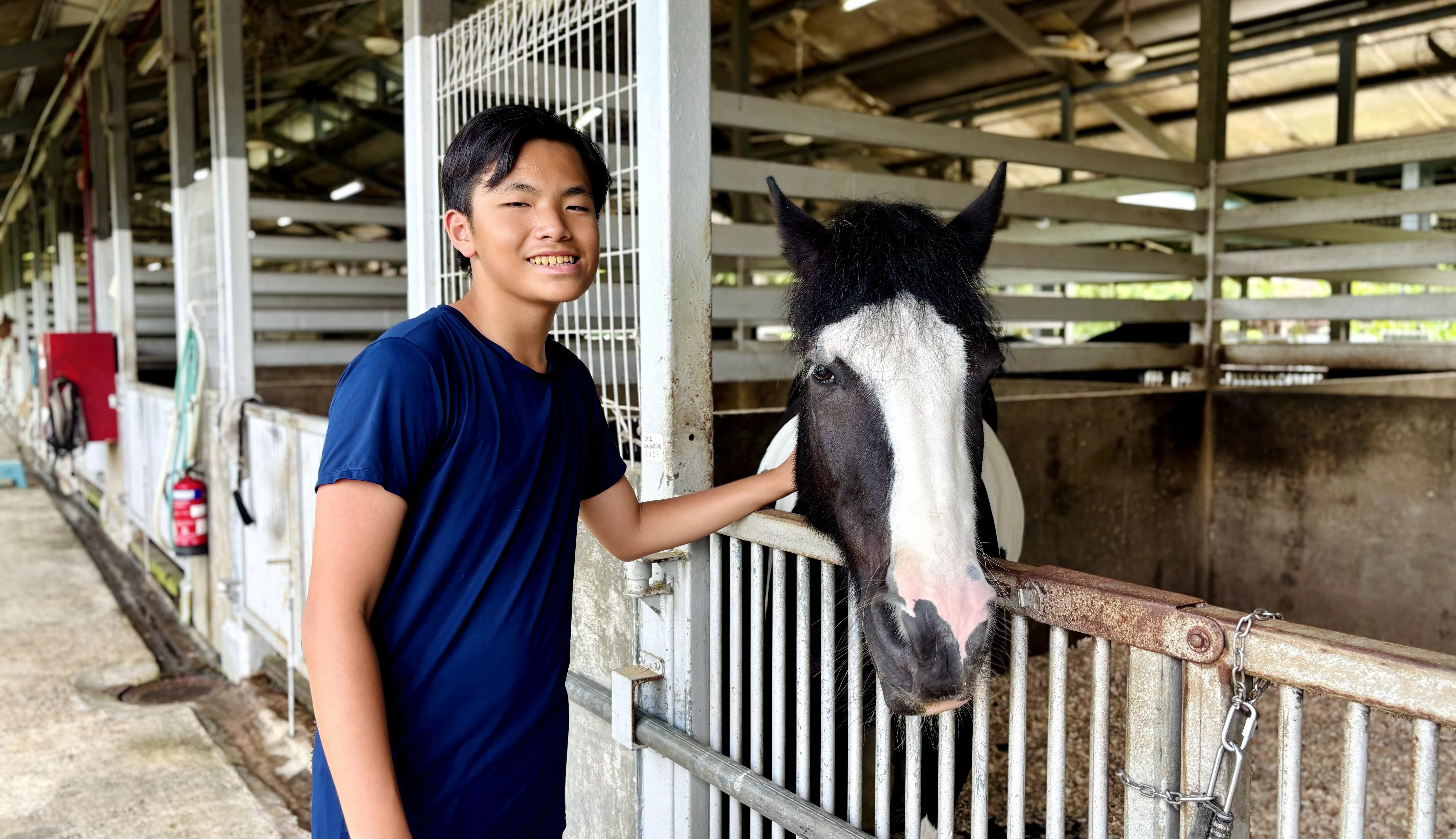 Darius with hand on a horse.